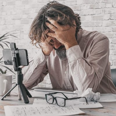 man-working-at-home-on-the-table-with-desperate-ex-2025-03-06-11-57-21-utc-scaled-e1749169247444.jpg